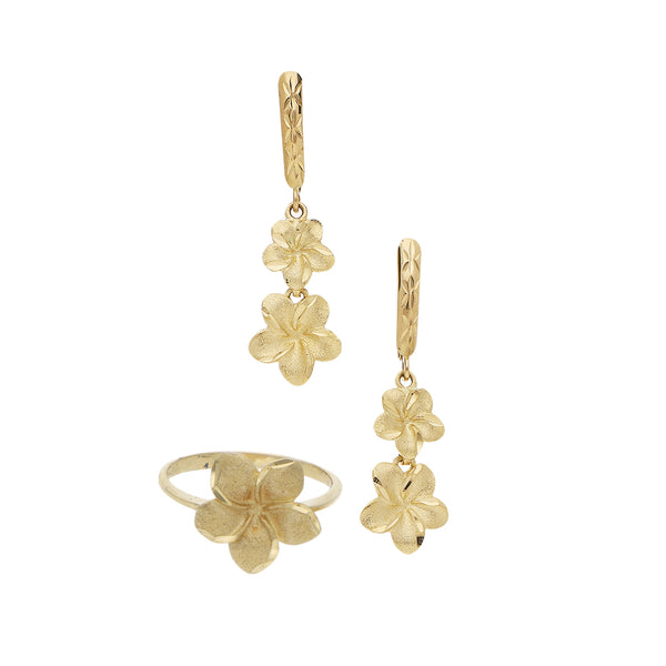 Juego de anillo y aretes estilizados motivo flor en oro amarillo 14 kilates.