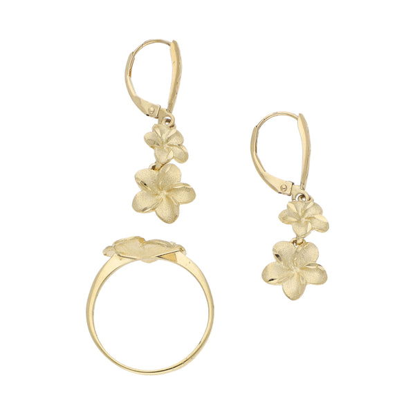 Juego de anillo y aretes estilizados motivo flor en oro amarillo 14 kilates.