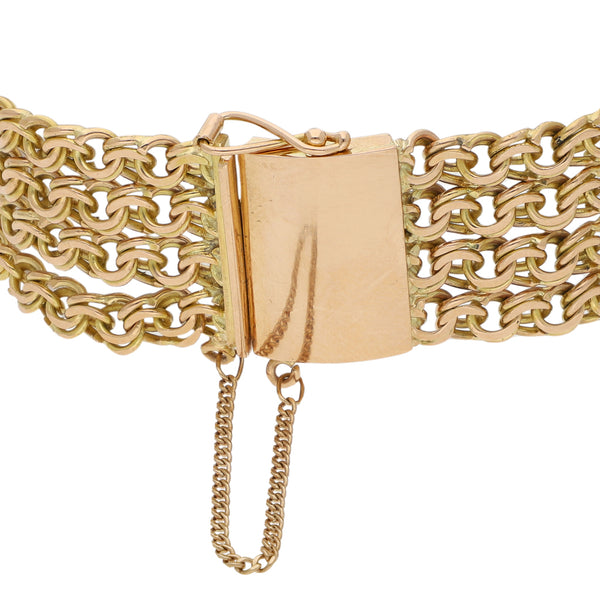 Pulsera cuatro hilos eslabón cruzado doble en oro amarillo 18 kilates.