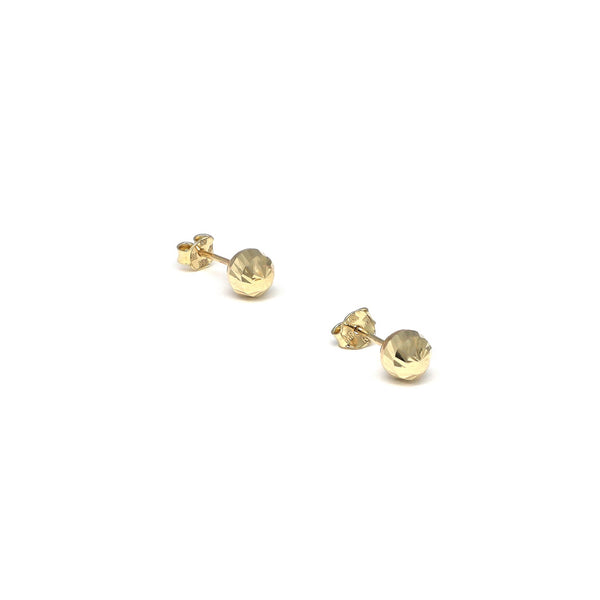 Aretes huecos motivo esfera en oro amarillo 14 kilates.