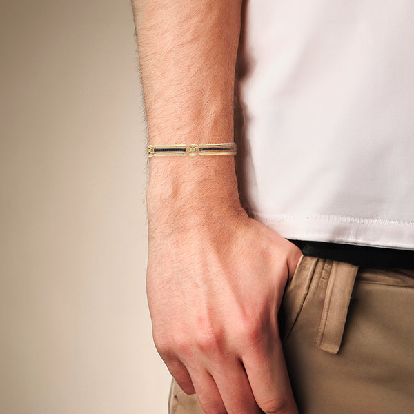 Pulsera eslabón articulado con sintéticos en oro amarillo 14 kilates.