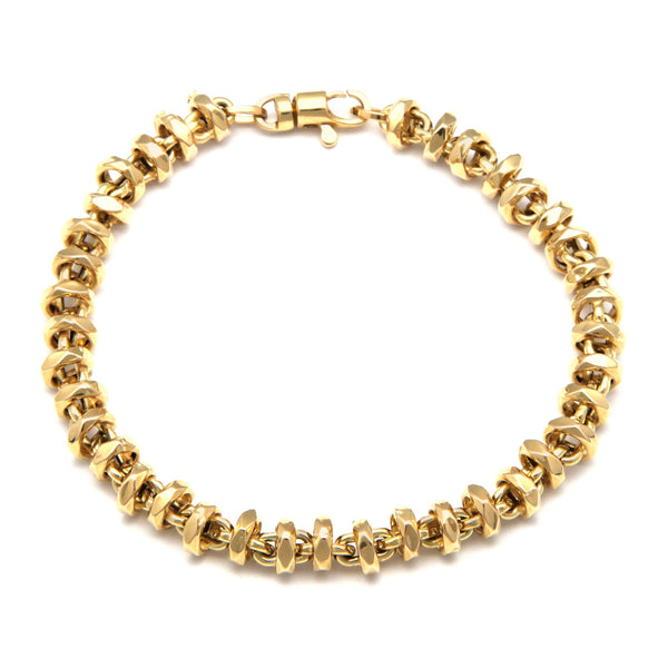 Pulsera eslabón combinado en oro amarillo 14 kilates.