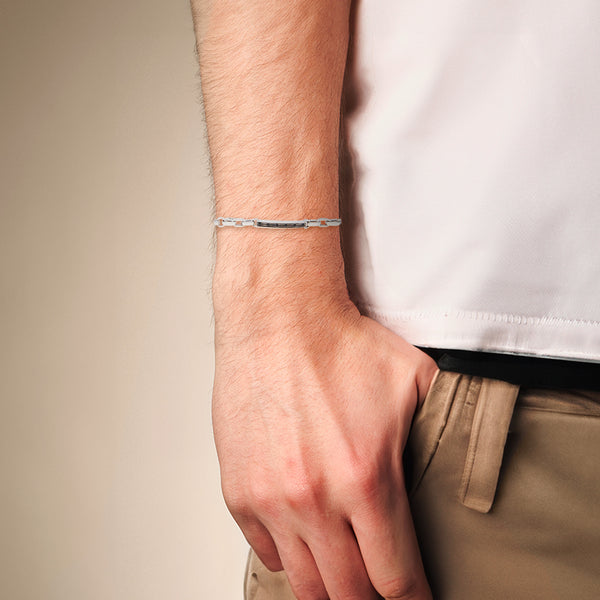 Pulsera eslabón combinado con aplicaciones y sintéticos en oro blanco 14 kilates.