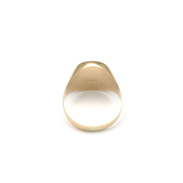 Anillo tipo sello con ónix en oro amarillo 14 kilates.