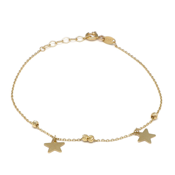 Pulsera eslabón cruzado con aplicaciones motivo esferas y estrellas en oro amarillo 14 kilates.