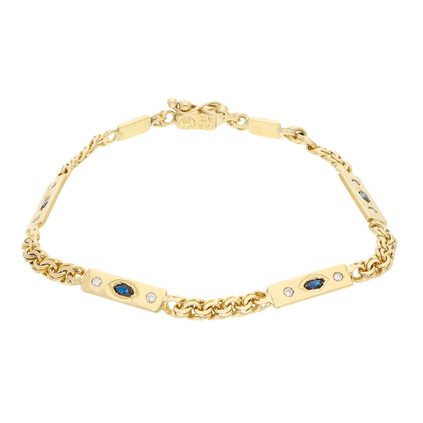 Pulsera eslabón articulado con diamantes y zafiros en oro amarillo 14 kilates.