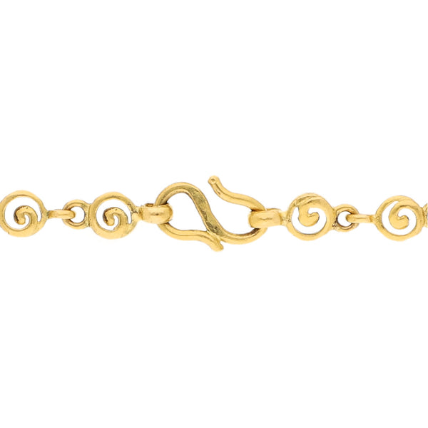 Pulsera eslabón combinado con aplicaciones motivo flor en oro amarillo 24 kilates.