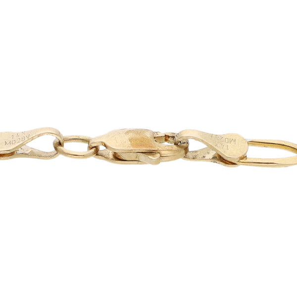 Pulsera de tres eslabones por uno platinados en oro amarillo 14 kilates.