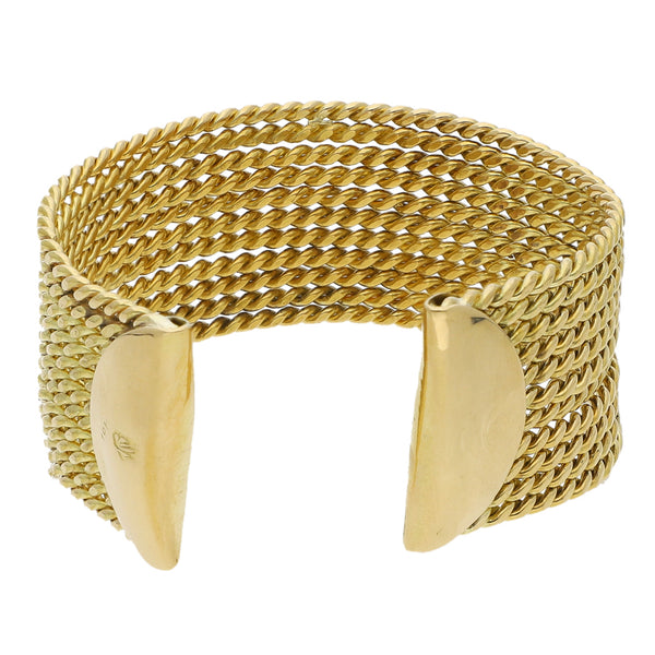 Brazalete de once hilos abierto en oro amarillo 18 kilates.