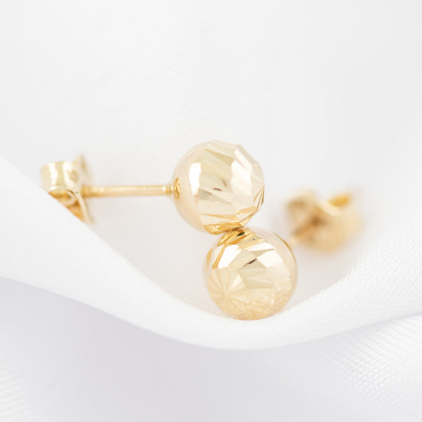 Aretes huecos motivo esfera facetada en oro amarillo 14 kilates