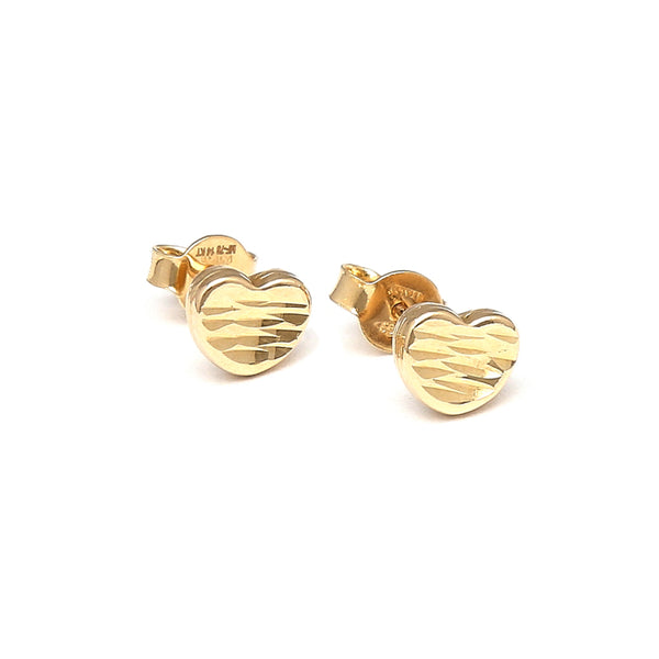 Aretes huecos motivo corazón en oro amarillo 14 kilates.