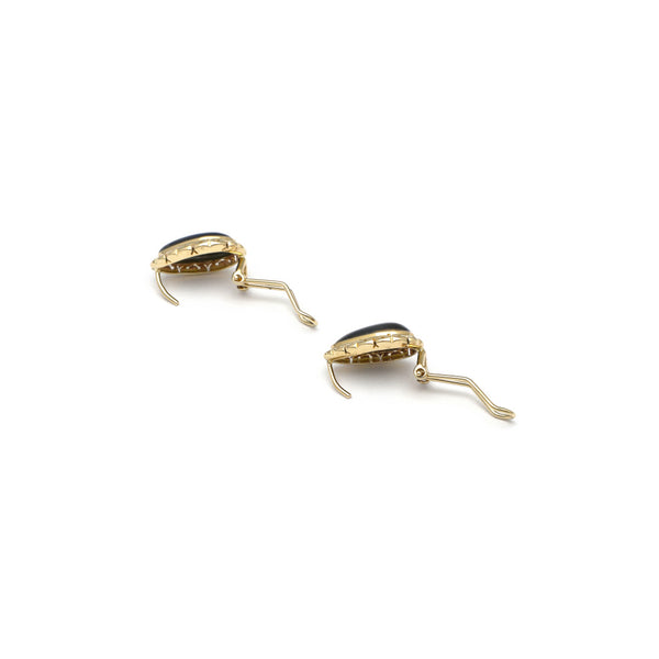 Aretes calados con ojo de tigre black en oro amarillo 14 kilates.