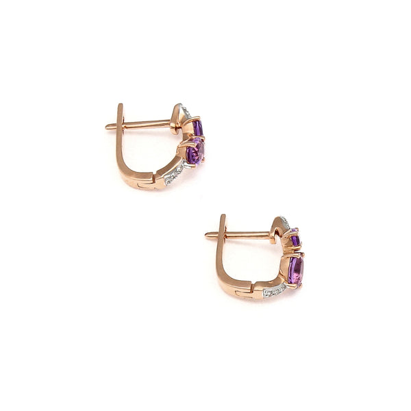 Aretes articulados con diamantes y amatistas en oro rosa 14 kilates.