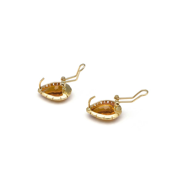 Aretes calados con citrinos en oro amarillo 14 kilates.