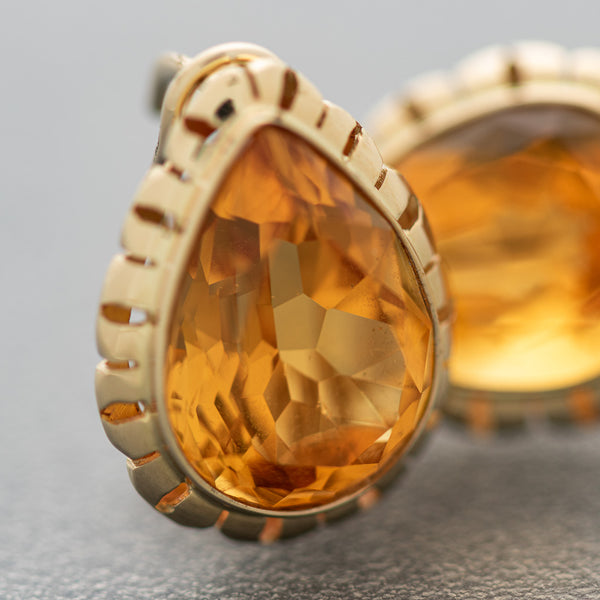 Aretes calados con citrinos en oro amarillo 14 kilates.