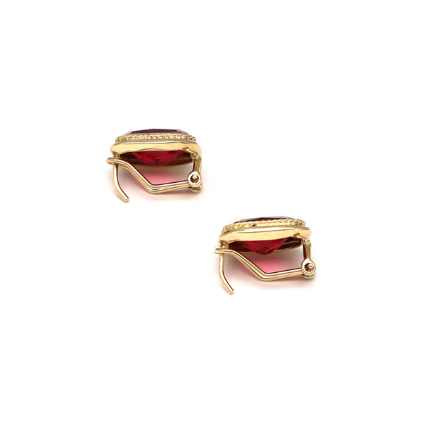 Aretes diseño especial con rubies en oro amarillo 14 kilates.