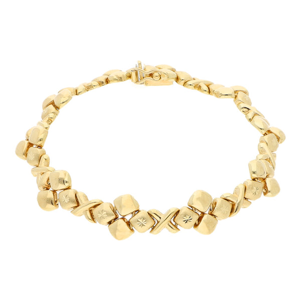 Pulsera eslabón combinado en oro amarillo 14 kilates.