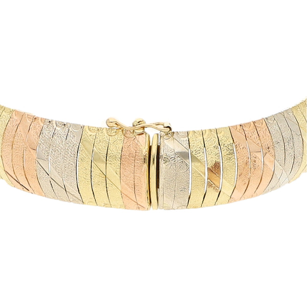 Pulsera eslabón laminado en oro tres tonos 14 kilates.