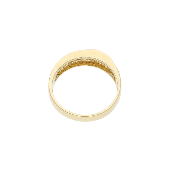 Anillo calado con sintéticos en oro amarillo 14 kilates.