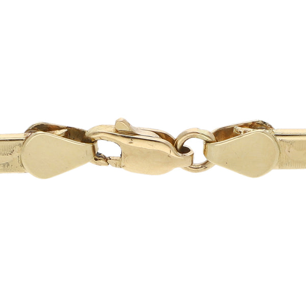 Pulsera eslabón laminado motivo delfines en oro amarillo 14 kilates.