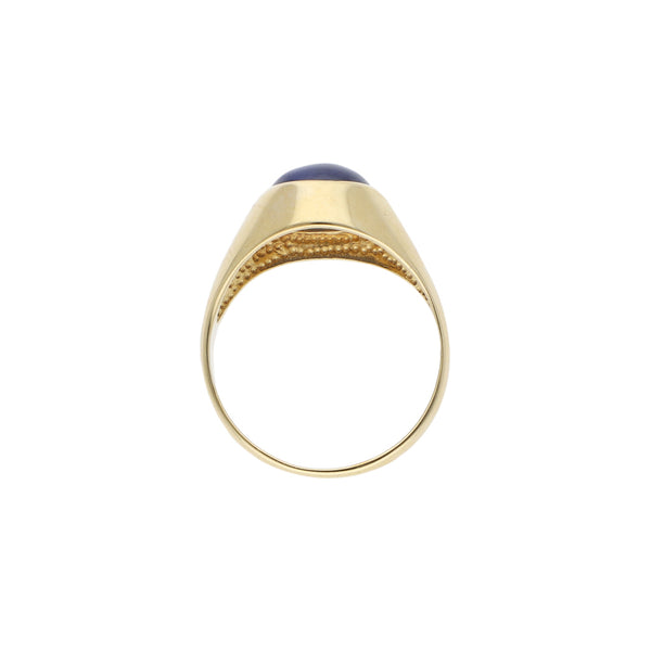 Anillo tipo sello con zafiro estrella en oro amarillo 14 kilates.