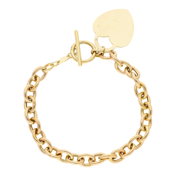 Pulsera eslabón cruzado con colgante motivo corazón en oro amarillo 14 kilates.