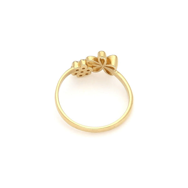 Anillo calado motivo flor con circonias en oro amarillo 14 kilates.