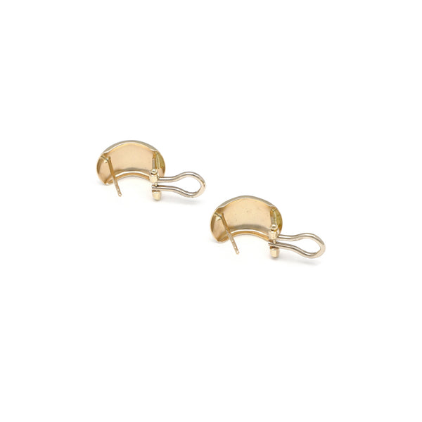 Aretes lisos en oro amarillo 14 kilates.