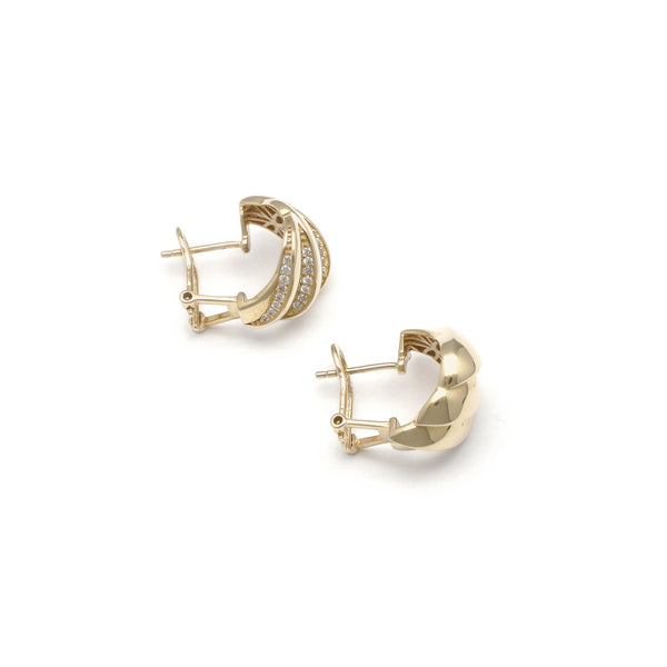 Aretes diseño especial con circonias en oro amarillo 14 kilates.