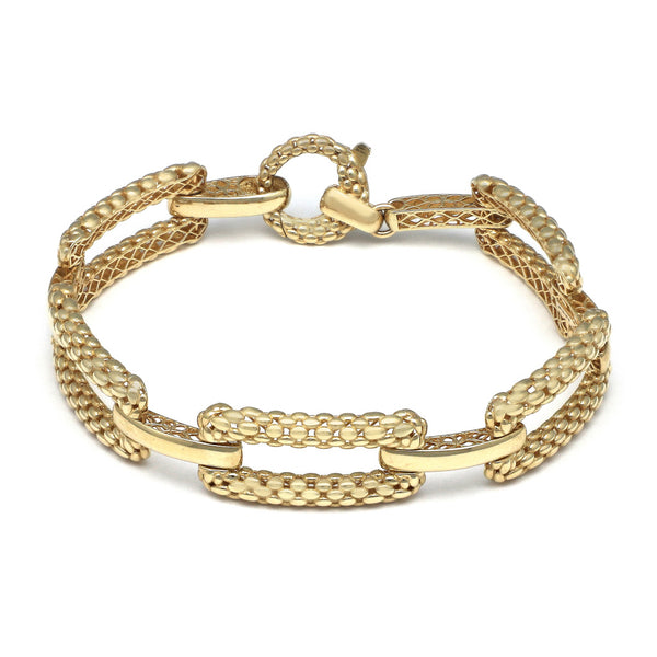 Pulsera eslabón combinado en oro amarillo 14 kilates.