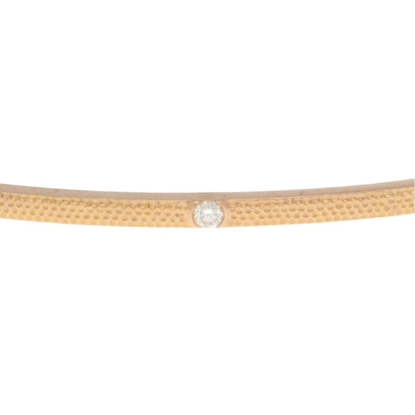 Pulsera de arillo rígida con diamantes firma De Beers en oro rosa 18 kilates.