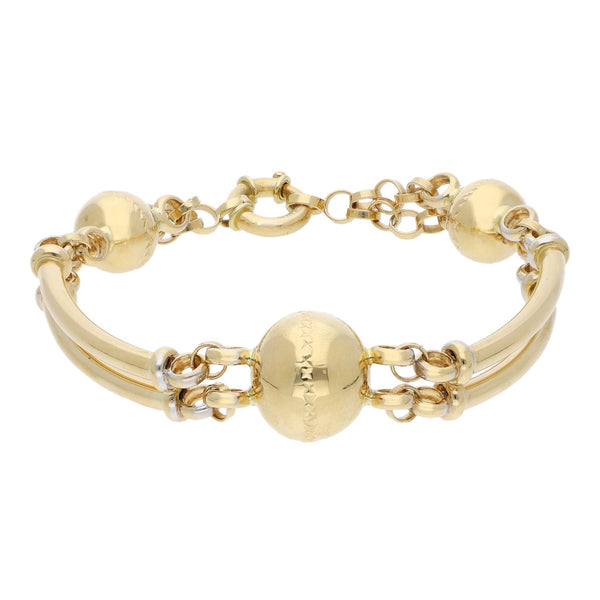 Pulsera eslabón combinado con aplicaciones motivo esferas en oro amarillo 14 kilates.