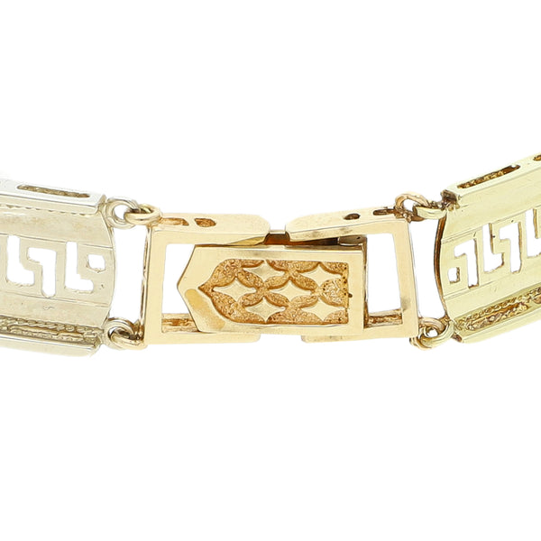 Pulsera eslabón articulado con aplicaciones motivo elefantes y sintéticos en oro tres tonos 14 kilates.