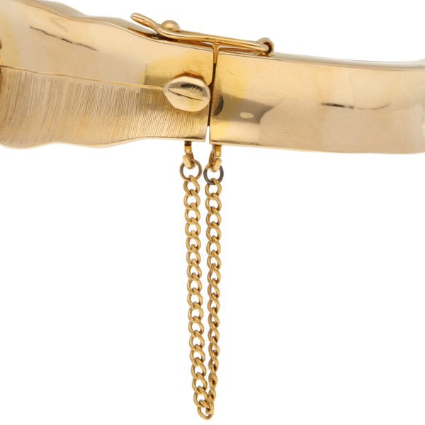 Pulsera de arillo articulada con diamantes en oro amarillo 18 kilates.