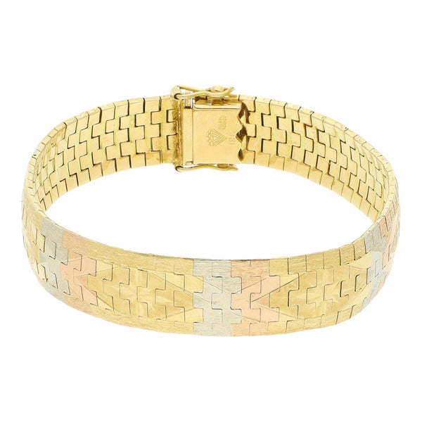 Pulsera eslabón planchado en oro tres tonos 18 kilates.