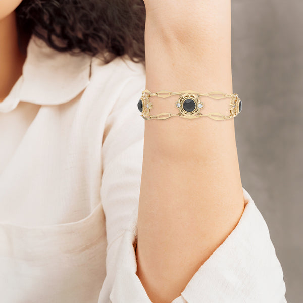 Pulsera eslabón articulado con sinteticos en oro amarillo 14 kilates.