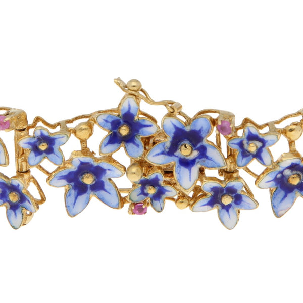 Pulsera eslabón articulado motivo flores con rubies y esmalte en oro amarillo 18 kilates.