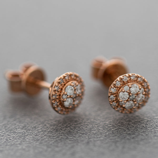 Aretes diseño especial con diamantes en oro rosa 14 kilates.