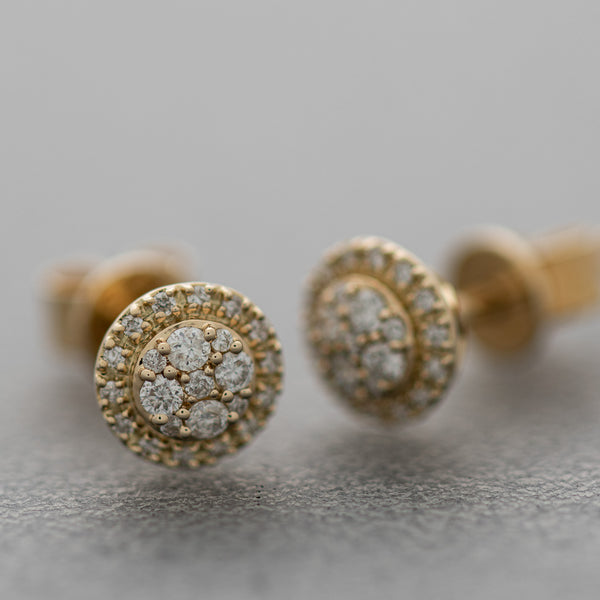 Aretes diseño especial con diamantes en oro amarillo 14 kilates.