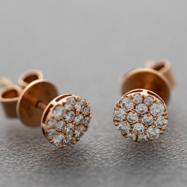 Aretes diseño especial con diamantes en oro rosa 18 kilates.