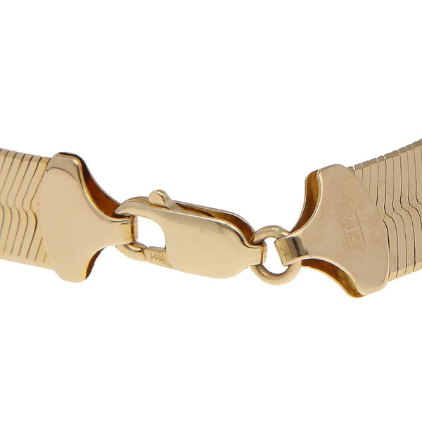 Pulsera eslabón planchado en oro amarillo 14 kilates.