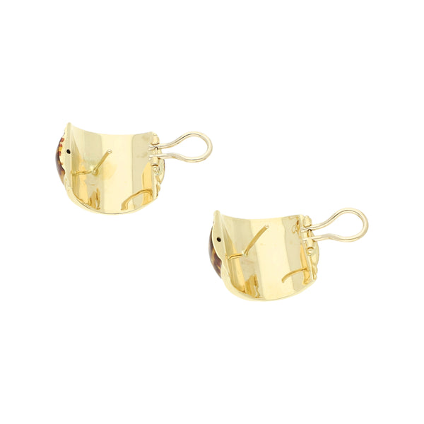 Aretes diseño especial con esmalte oro amarillo 14 kilates.