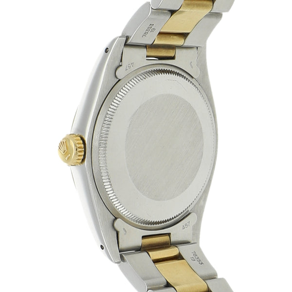 Reloj Rolex para caballero modelo Oyster Perpetual Date vistas en oro amarillo 14 kilates.