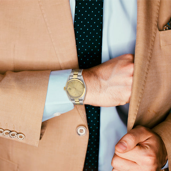 Reloj Rolex para caballero modelo Oyster Perpetual Date vistas en oro amarillo 14 kilates.