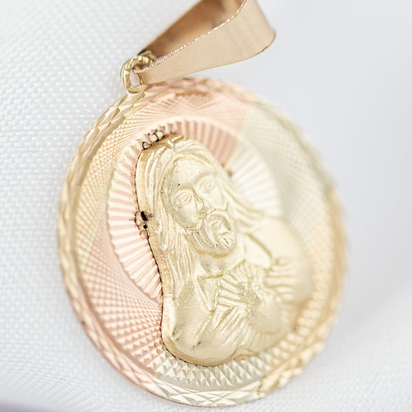 Medalla facetada motivo Sagrado Corazón de Jesús en oro amarillo 14 kilates.