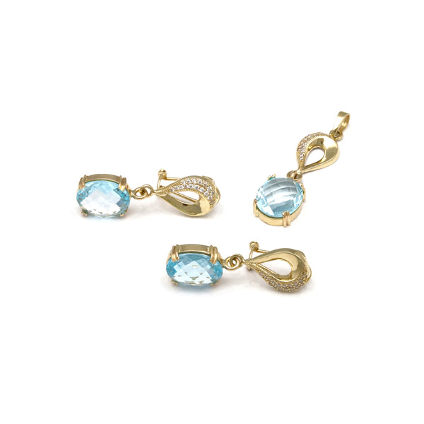 Juego aretes y dije diseño especial con sky blue y circonias en oro amarillo 14 kilates.