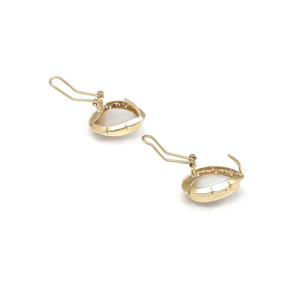 Aretes calados con perla en oro amarillo 14 kilates.