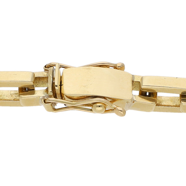 Pulsera eslabón cruzado en oro amarillo 18 kilates.