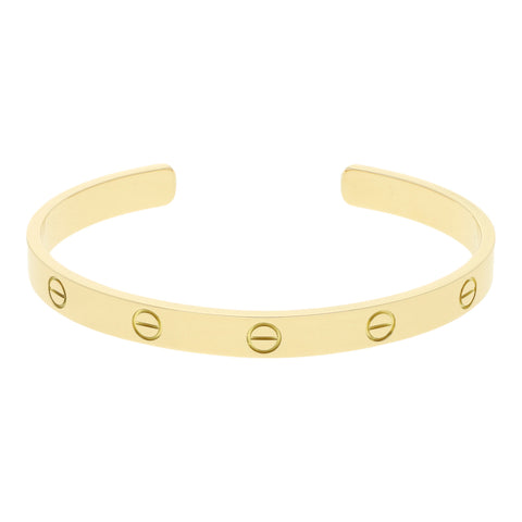 Pulsera de arillo abierta firma Cartier en oro amarillo 18 kilates.