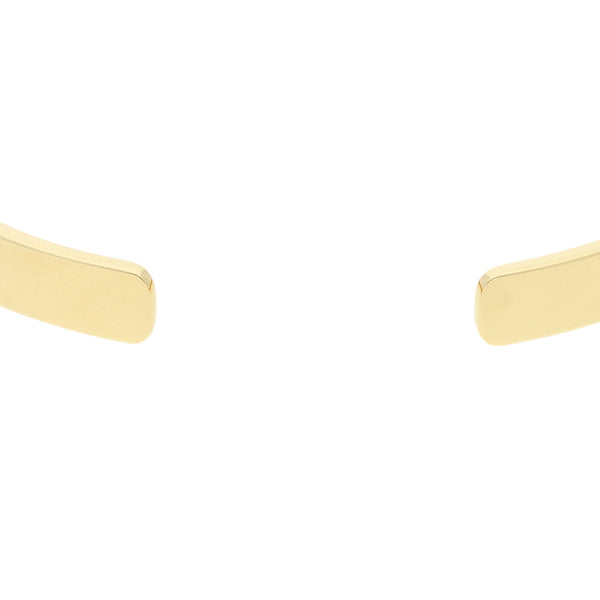 Pulsera de arillo abierta firma Cartier en oro amarillo 18 kilates.